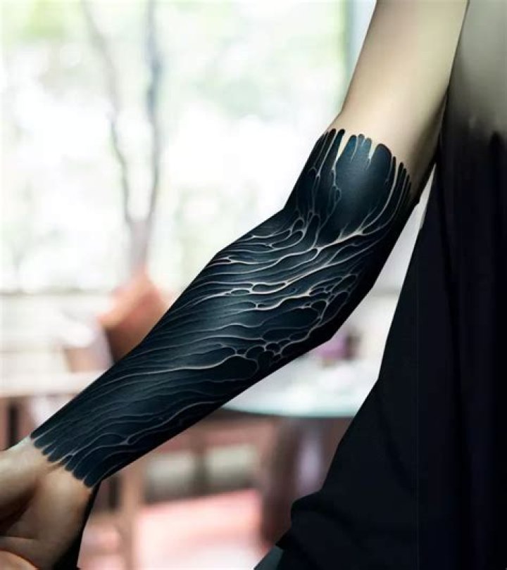 Exploring The Allure Of The Black Out Tattoo Girl